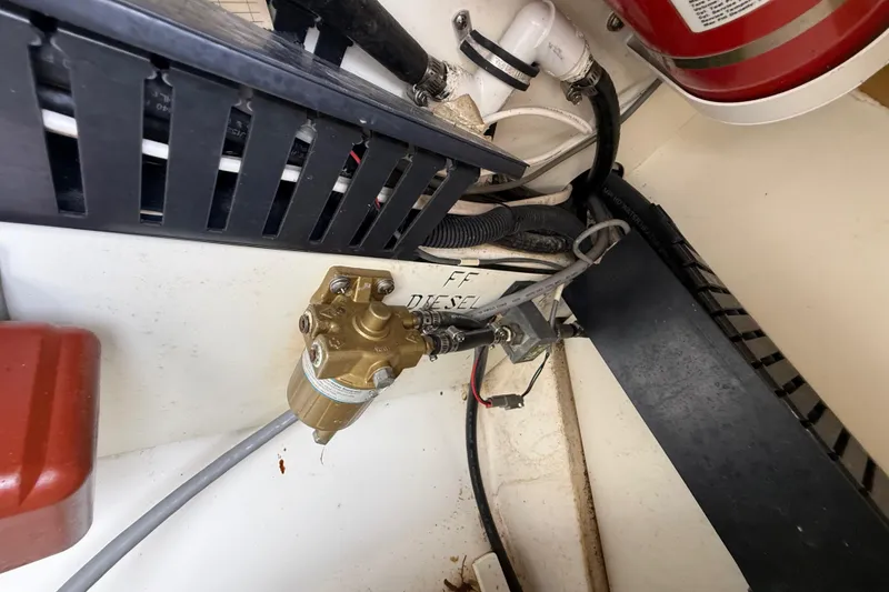 Slide: The Image of Engine compartment of 2022 Pursuit S 358 Sport with fuel system components. - 100