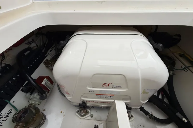 Slide: The Image of Engine compartment of 2022 Pursuit S 358 Sport boat with Fischer Panda generator. - 101