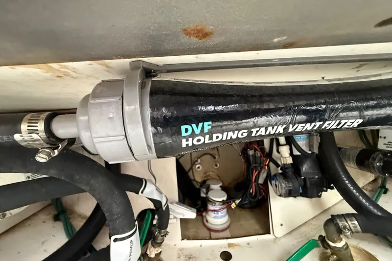 Slide: The Image of 2022 Pursuit S 358 Sport boat's DVF holding tank vent filter system. - 105