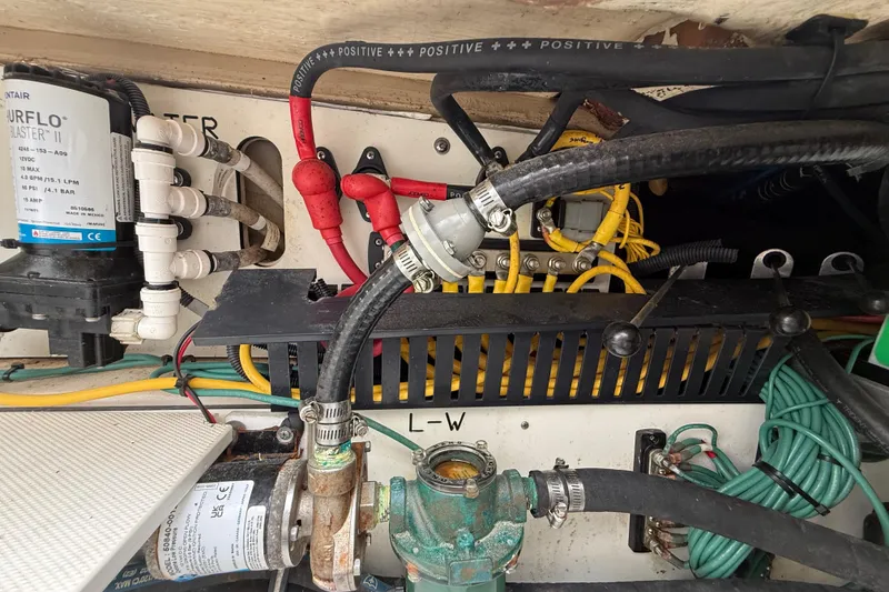 Slide: The Image of Engine compartment of 2022 Pursuit S 358 Sport with wiring and components. - 111