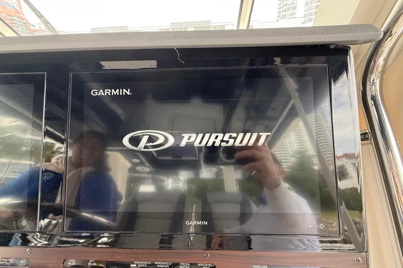 Slide: The Image of Garmin display on 2022 Pursuit S 358 Sport boat dashboard. - 113