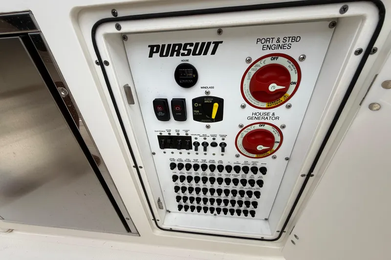 Slide: The Image of Control panel of 2022 Pursuit S 358 Sport boat with switches and dials. - 114