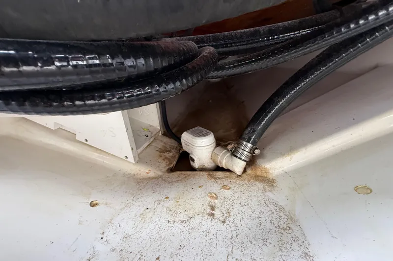 Slide: The Image of 2022 Pursuit S 358 Sport boat interior with hoses and fittings. - 118