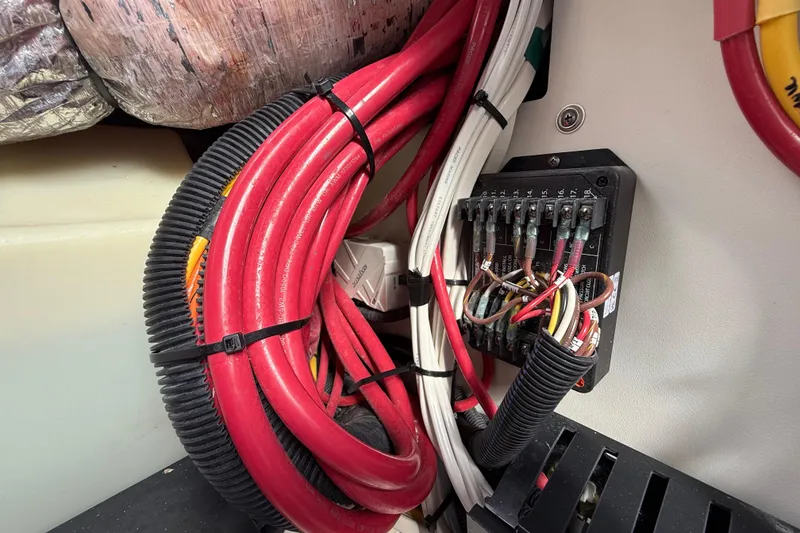 Slide: The Image of Electrical wiring and fuse panel in 2022 Pursuit S 358 Sport boat. - 124