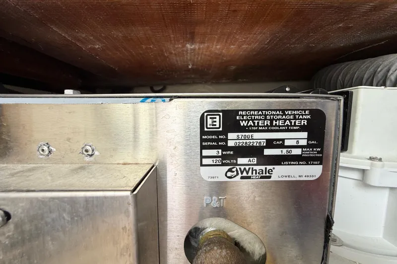 Slide: The Image of Water heater label on 2022 Pursuit S 358 Sport, showing model S700E, 6-gallon capacity. - 125