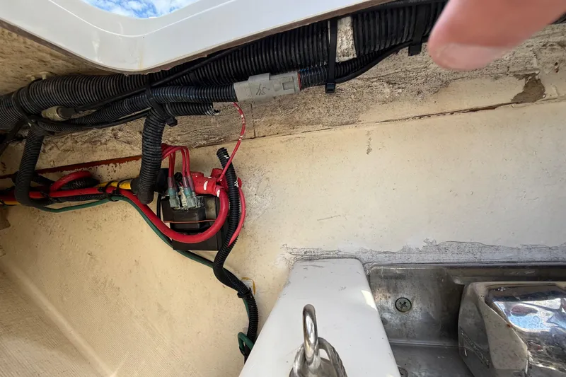 Slide: The Image of Wiring and components inside a 2022 Pursuit S 358 Sport boat. - 127