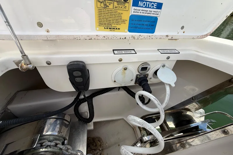 Slide: The Image of 2022 Pursuit S 358 Sport boat water connections and controls in the stern area. - 132