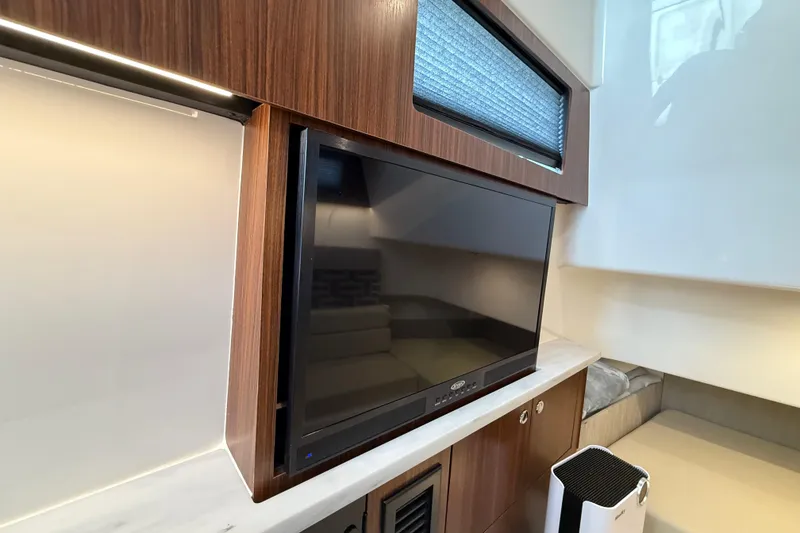 Slide: The Image of 2022 Pursuit S 358 Sport interior with TV and modern wood paneling. - 133