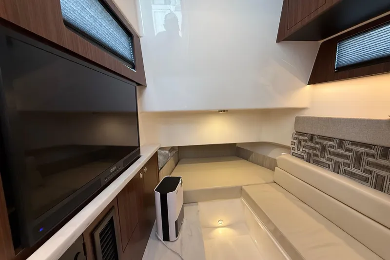 Slide: The Image of Luxurious interior of 2022 Pursuit S 358 Sport boat with modern seating and entertainment system. - 134