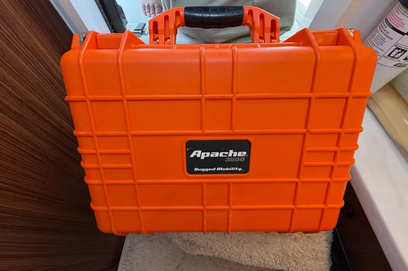 Slide: The Image of Orange Apache 3800 rugged mobility case on a 2022 Pursuit S 358 Sport boat. - 149