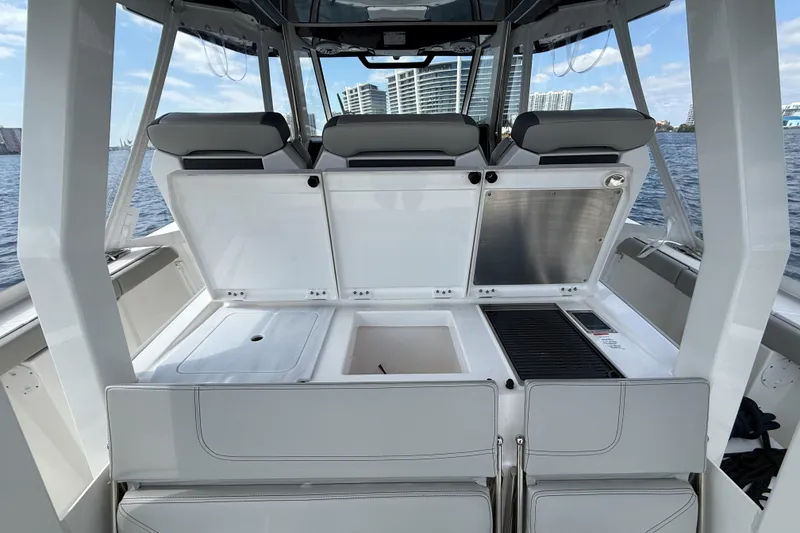 Slide: The Image of 2022 Pursuit S 358 Sport boat with city skyline and water view. - 3