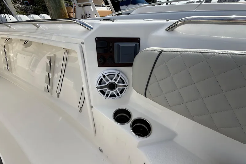 Slide: The Image of 2022 Pursuit S 358 Sport boat interior with speaker and quilted seat detail. - 32