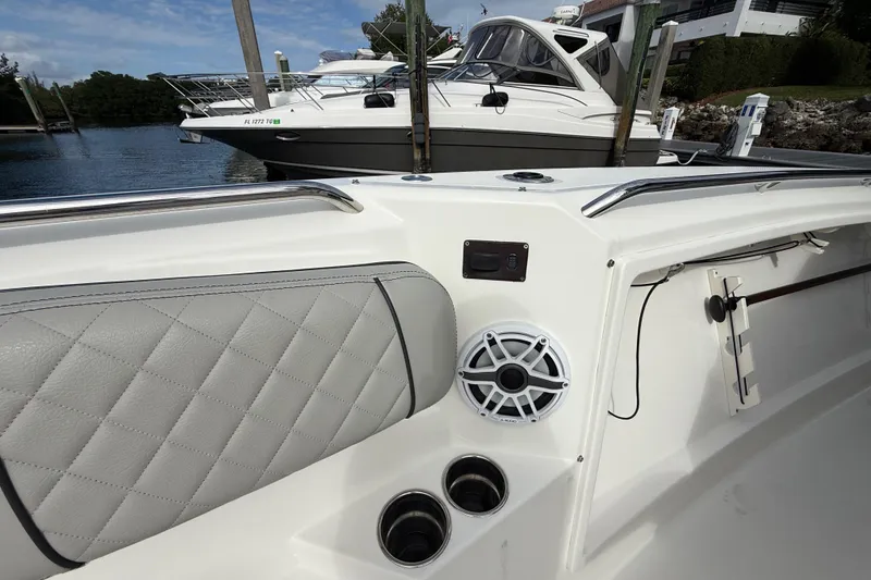 Slide: The Image of 2022 Pursuit S 358 Sport boat interior with speaker and cup holders. - 33