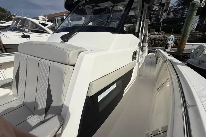 Slide: The Image of 2022 Pursuit S 358 Sport boat with sleek design and comfortable seating. - 34