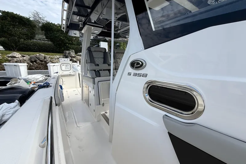 Slide: The Image of 2022 Pursuit S 358 Sport boat interior with seating and sleek design. - 38