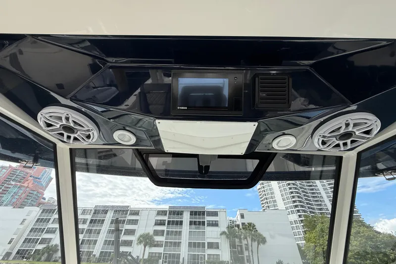 Slide: The Image of Interior view of 2022 Pursuit S 358 Sport boat with speakers and control panel. - 49