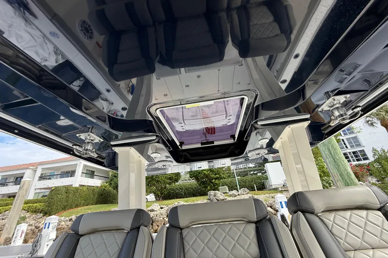 Slide: The Image of Interior view of 2022 Pursuit S 358 Sport boat with luxurious seating and sleek design. - 54