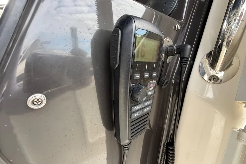 Slide: The Image of Marine radio on 2022 Pursuit S 358 Sport boat, mounted on a sleek panel. - 57