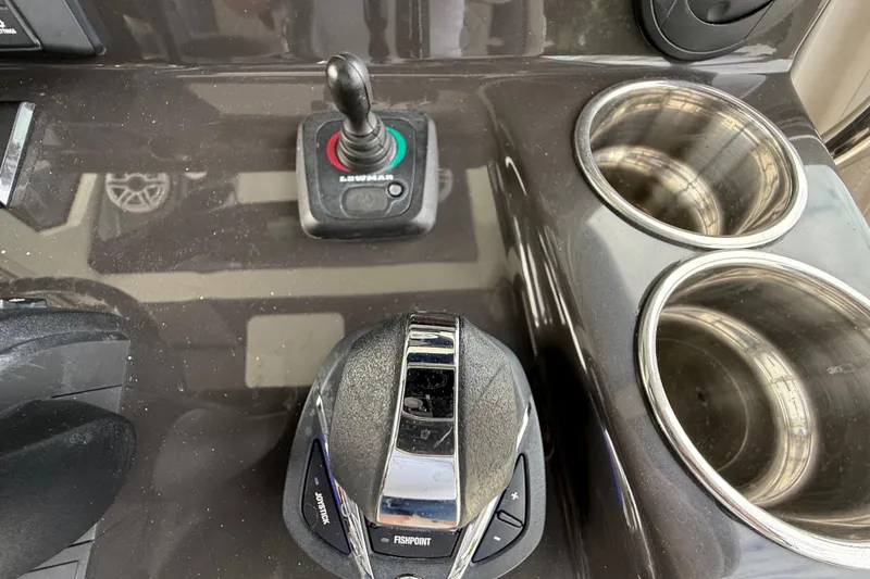 Slide: The Image of Control panel of 2022 Pursuit S 358 Sport boat with joystick and cup holders. - 58