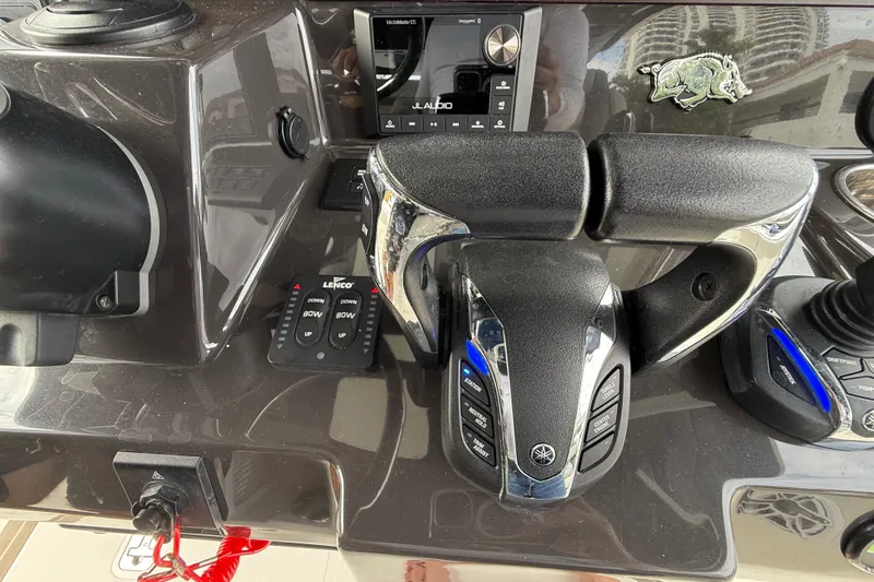 Slide: The Image of Control panel of 2022 Pursuit S 358 Sport boat with throttle and navigation controls. - 59
