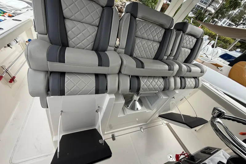 Slide: The Image of Luxury seating on 2022 Pursuit S 358 Sport boat with quilted upholstery and modern design. - 62