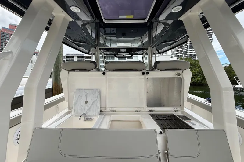 Slide: The Image of 2022 Pursuit S 358 Sport boat interior with seating and amenities. - 68