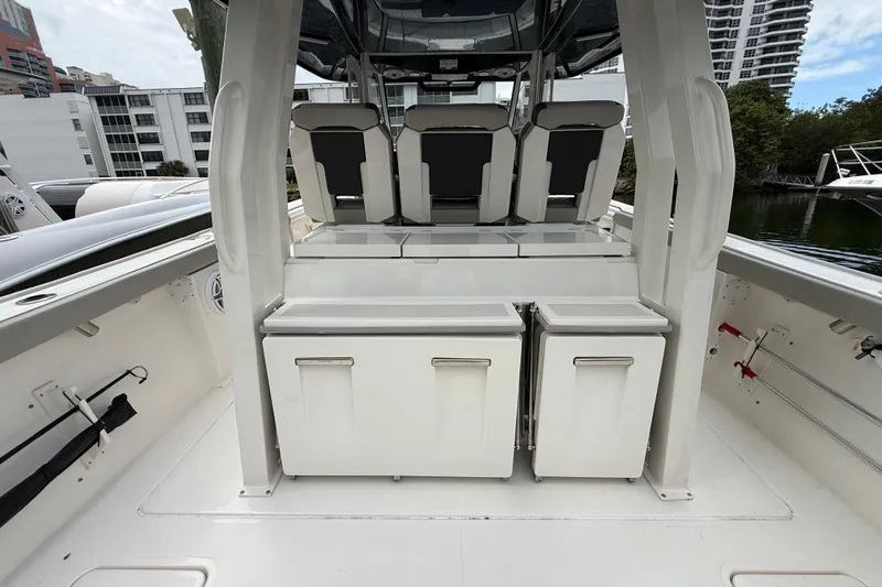 Slide: The Image of 2022 Pursuit S 358 Sport boat interior with seating and storage compartments. - 71