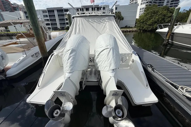 Slide: The Image of 2022 Pursuit S 358 Sport boat docked with covered engines. - 8