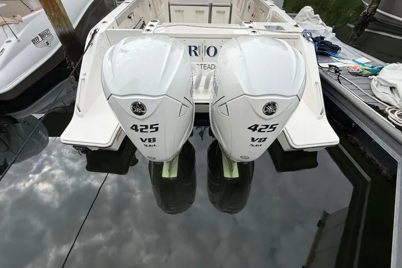 Slide: The Image of 2022 Pursuit S 358 Sport boat with twin Yamaha 425 V8 engines docked. - 84