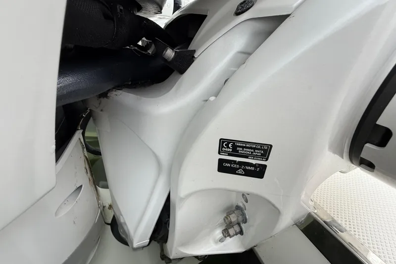 Slide: The Image of Close-up of 2022 Pursuit S 358 Sport boat engine details and label. - 87