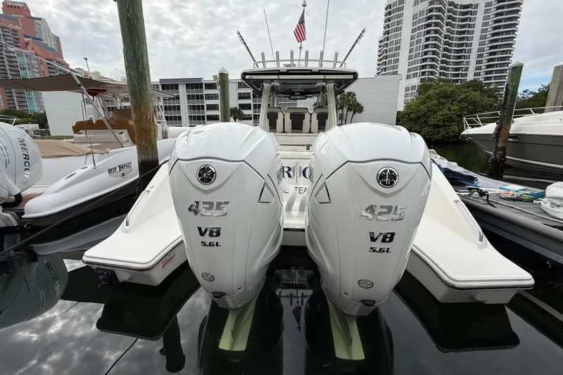 Slide: The Image of 2022 Pursuit S 358 Sport boat with twin 425 V8 engines docked in marina. - 90