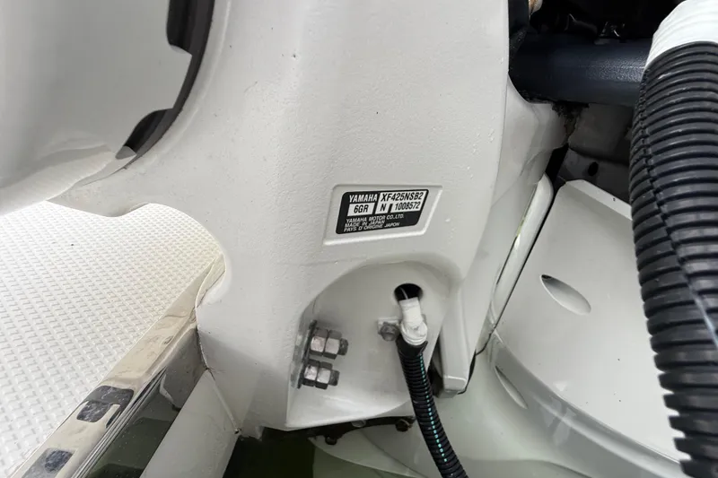 Slide: The Image of Close-up of 2022 Pursuit S 358 Sport boat engine details and label. - 94