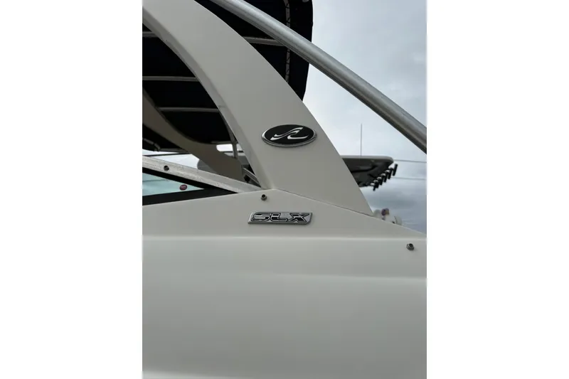 Slide: The Image of 2011 Sea Ray 250 SLX boat detail with logo and sleek design elements. - 15