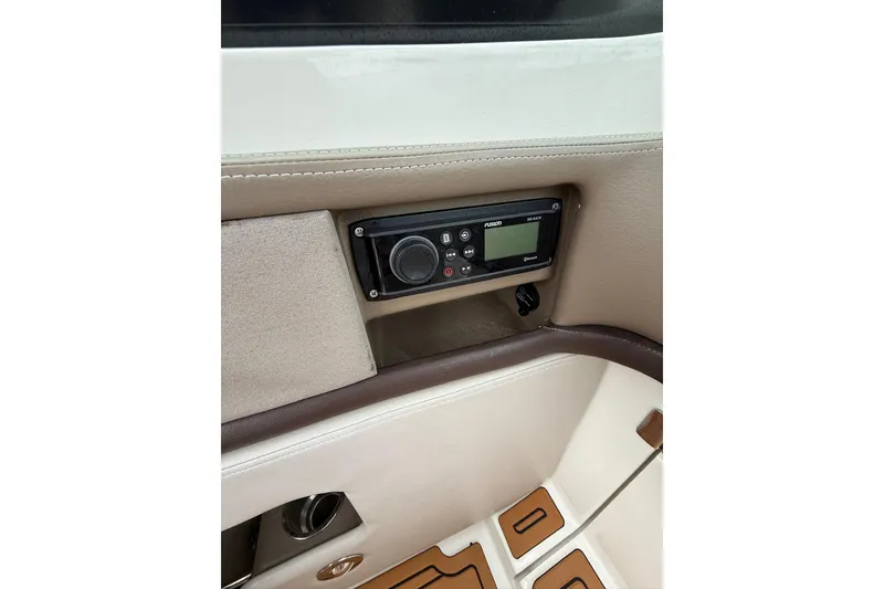 Slide: The Image of 2011 Sea Ray 250 SLX boat interior with audio control panel. - 17