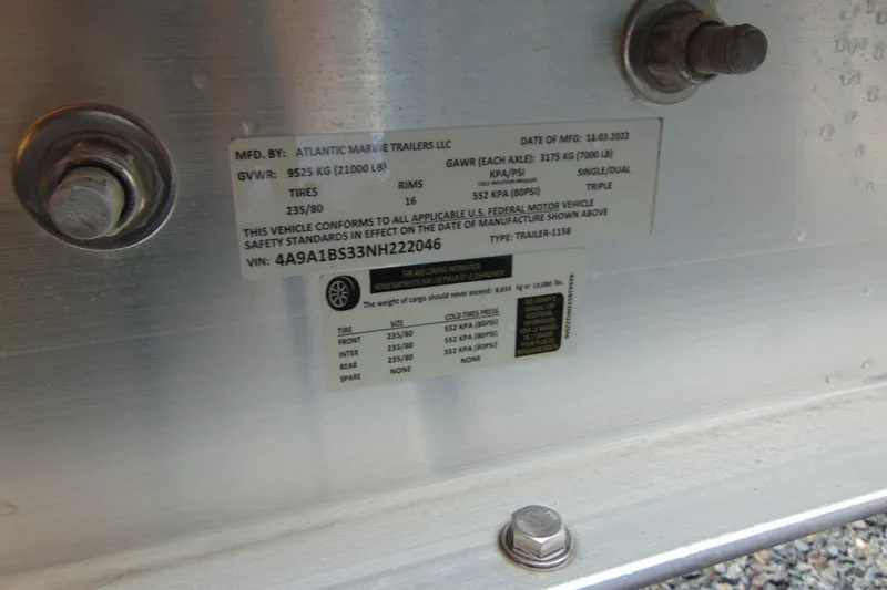 Slide: The Image of 2023 Nor-Tech 390 Sport Center Console trailer label, detailing specifications and compliance information. - 14