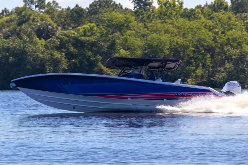 Slide: The Image of Luxurious seating in 2023 Nor-Tech 390 Sport Center Console boat, featuring diamond-stitched upholstery. - 15