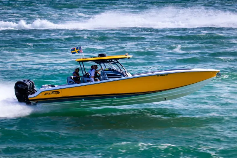 Slide: The Image of 2023 Nor-Tech 390 Sport Center Console interior with logo and speaker detail. - 19