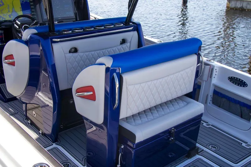 Slide: The Image of 2023 Nor-Tech 390 Sport Center Console interior with luxurious seating and modern design. - 25