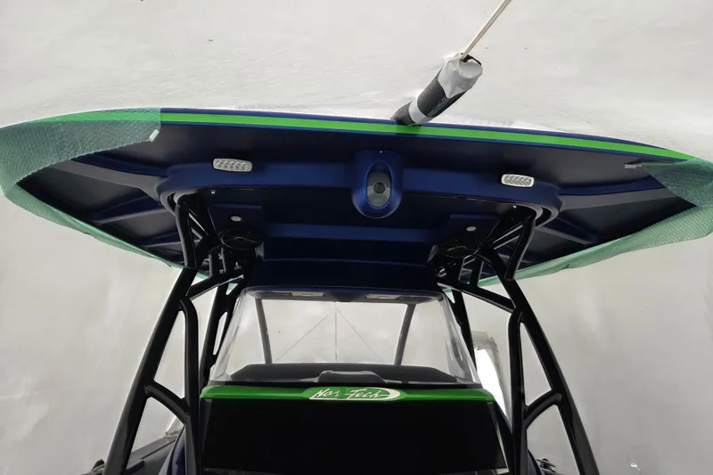 Slide: The Image of 2023 Nor-Tech 390 Sport Center Console boat with sleek T-top design. - 32