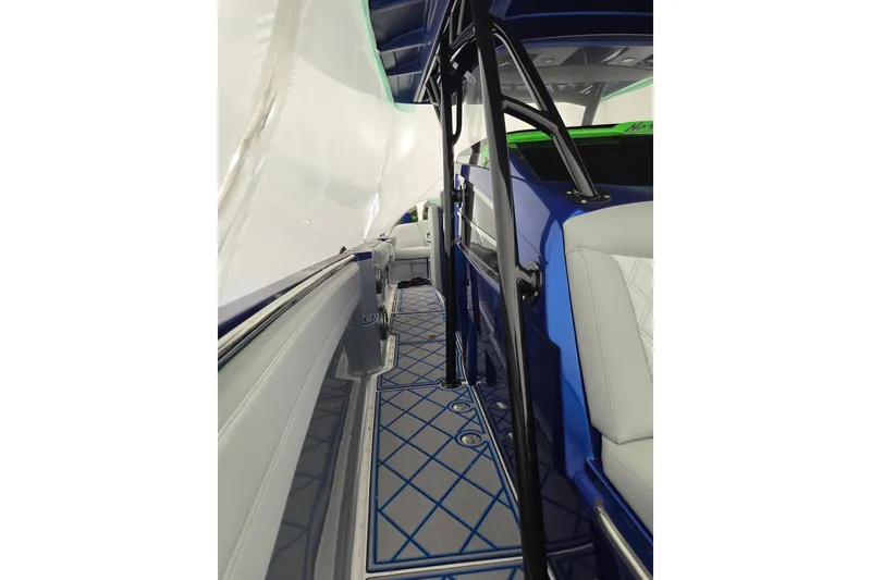 Slide: The Image of 2023 Nor-Tech 390 Sport Center Console interior with blue accents and sleek design. - 40