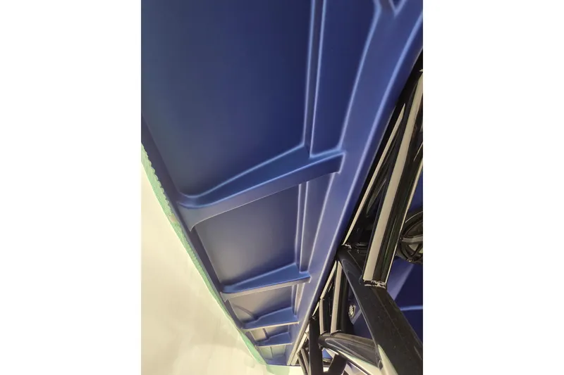 Slide: The Image of 2023 Nor-Tech 390 Sport Center Console, blue hull detail, sleek design. - 52