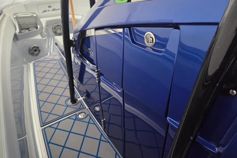 Slide: The Image of 2023 Nor-Tech 390 Sport Center Console with sleek blue finish and modern deck design. - 58
