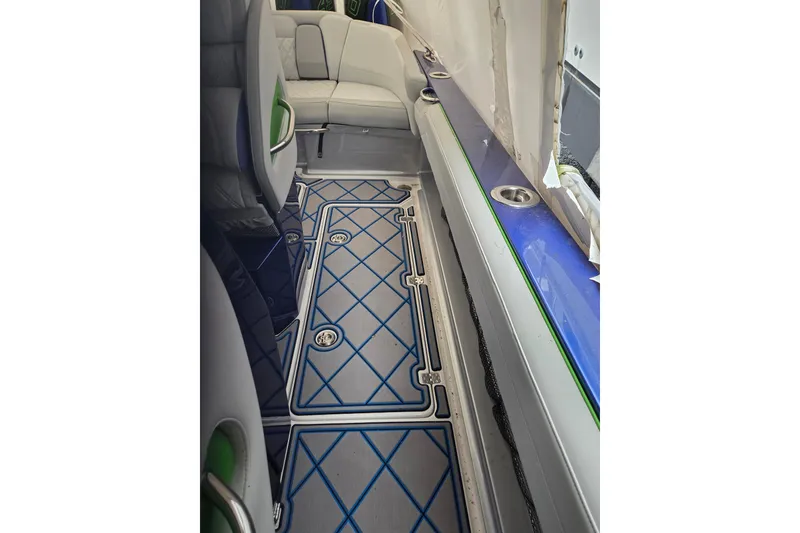 Slide: The Image of 2023 Nor-Tech 390 Sport Center Console interior with blue and white flooring design. - 65