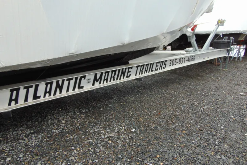 Slide: The Image of 2023 Nor-Tech 390 Sport Center Console on Atlantic Marine trailer, gravel lot. - 9