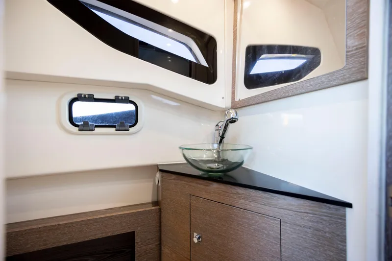 Slide: The Image of 2020 Zar Formenti 95 SL boat interior with modern sink and window. - 13
