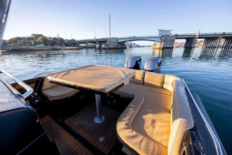 Slide: The Image of Zar Formenti 95 SL 2020 boat interior with seating and table, near a bridge. - 18