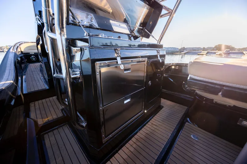 Slide: The Image of 2020 Zar Formenti 95 SL boat interior with sleek black design and wooden flooring. - 20