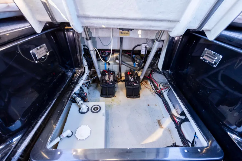 Slide: The Image of Interior view of 2020 Zar Formenti 95 SL boat's engine compartment with batteries and wiring. - 27