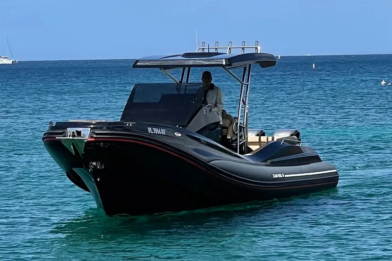 Slide: The Image of 2020 Zar Formenti 95 SL boat on calm water, featuring dual engines and sleek design. - 4