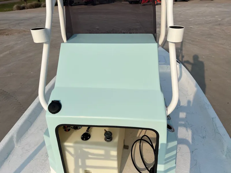 Slide: The Image of 2026 Shoalwater 19 CAT boat on parking lot under sunny sky. - 14